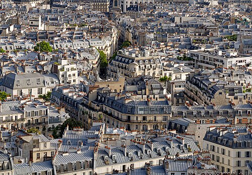 Zinc roofs, dormer windows and rows of terracotta chimney pots, looking south from the dome of the basilica.