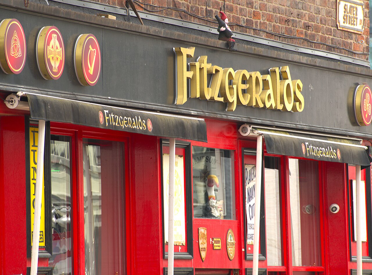 The Fitzgeralds front on Slater Street, red paint and gold lettering under black awnings, with the Slater Street sign on the brick above.