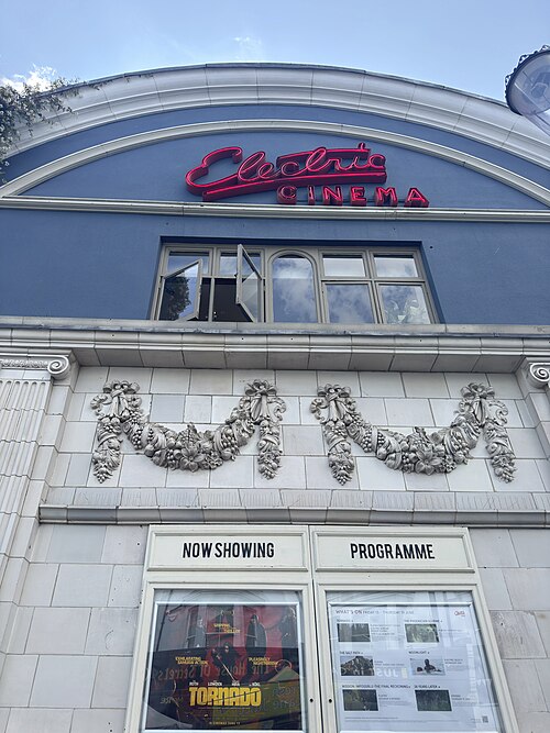 The Electric Cinema's Portobello Road facade, red neon script over the blue arch.