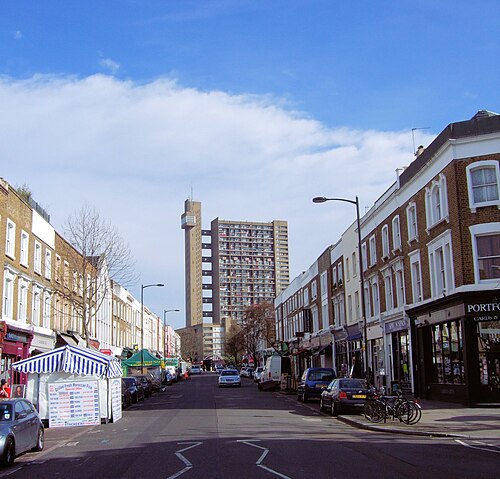 Golborne Road's stalls and shopfronts with Trellick Tower closing the view.