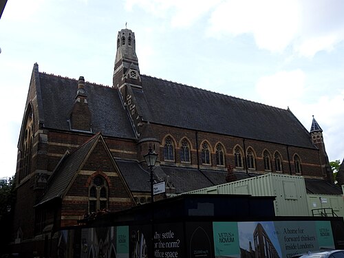 St Michael and All Angels seen from Mark Square, with the hoarding for the office conversion along the front of it.