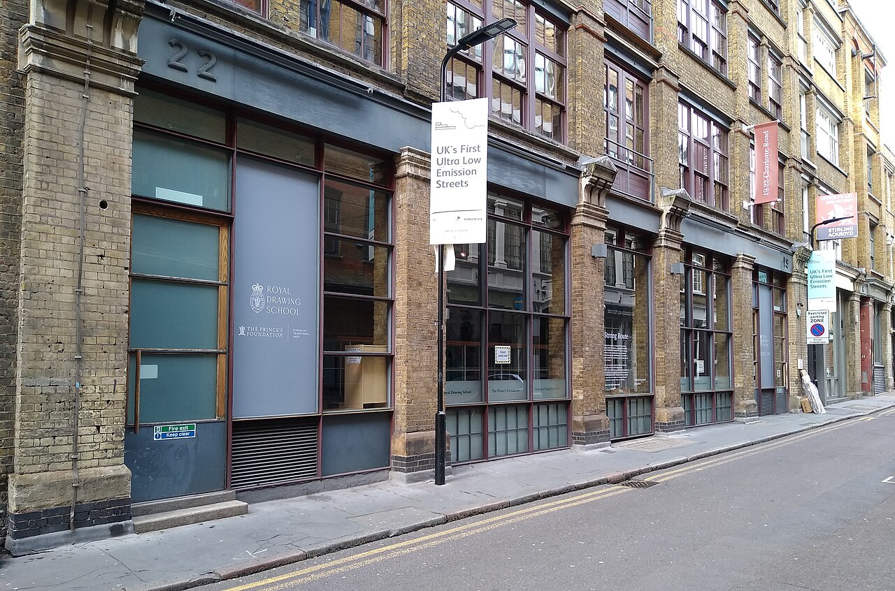 Warehouse fronts on Charlotte Road in yellow stock brick, with iron columns at pavement level and the Royal Drawing School at numbers 19 to 22.