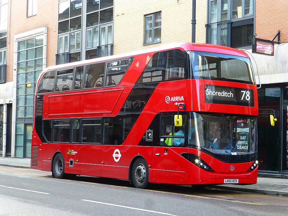 A route 78 bus standing at its Curtain Road terminus, with the brick and glass fronts of the street behind it.