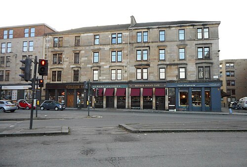 1349 to 1359 Argyle Street, a blond sandstone tenement with a restaurant, an antique shop and a pizzeria along the ground floor.