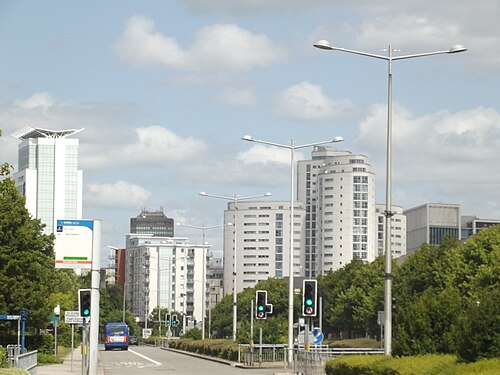Lloyd George Avenue, a wide boulevard lined with glass fronted apartment towers, tall streetlights down the median.