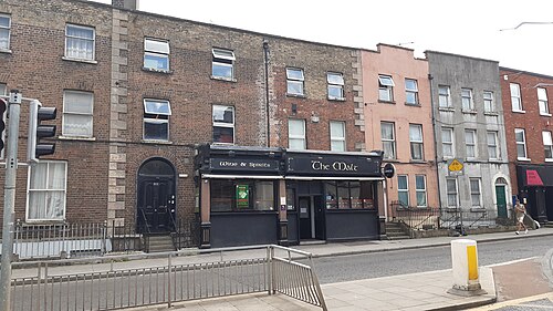 The Malt House pub on James's Street, a dark timber shopfront under a brick terrace.