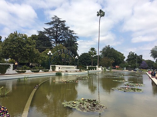 The Beverly Hills sign over the lily pond in Beverly Gardens Park, along Santa Monica Boulevard at the edge of the Golden Triangle.