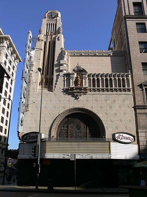 The Tower Theatre's clock tower and stained glass over the marquee.