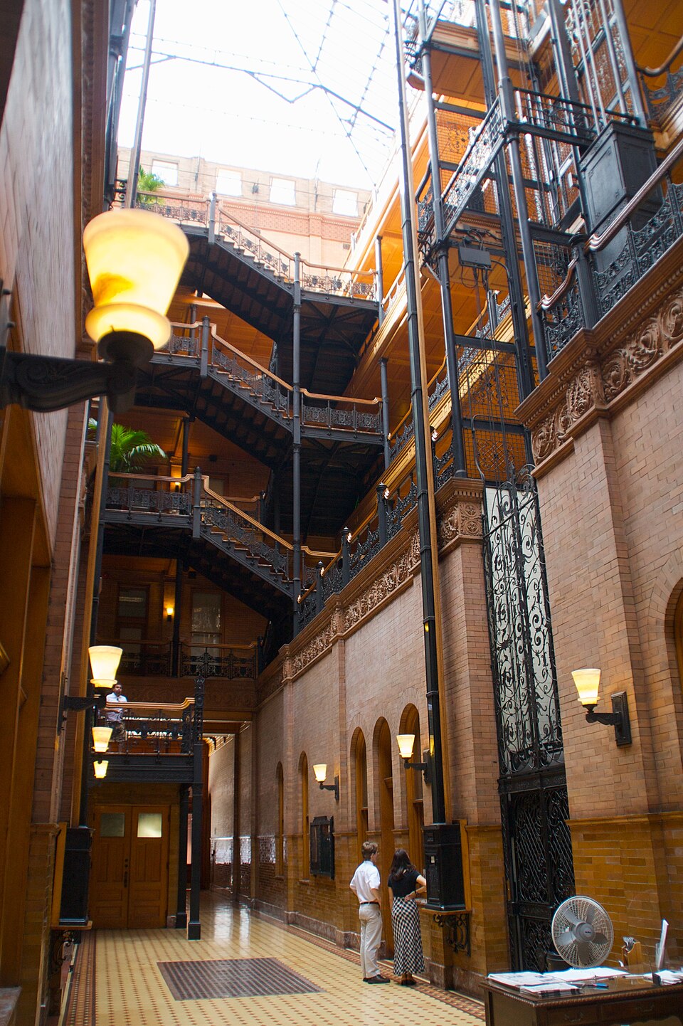 The Bradbury atrium, wrought iron railings, open cage elevators and the skylight.