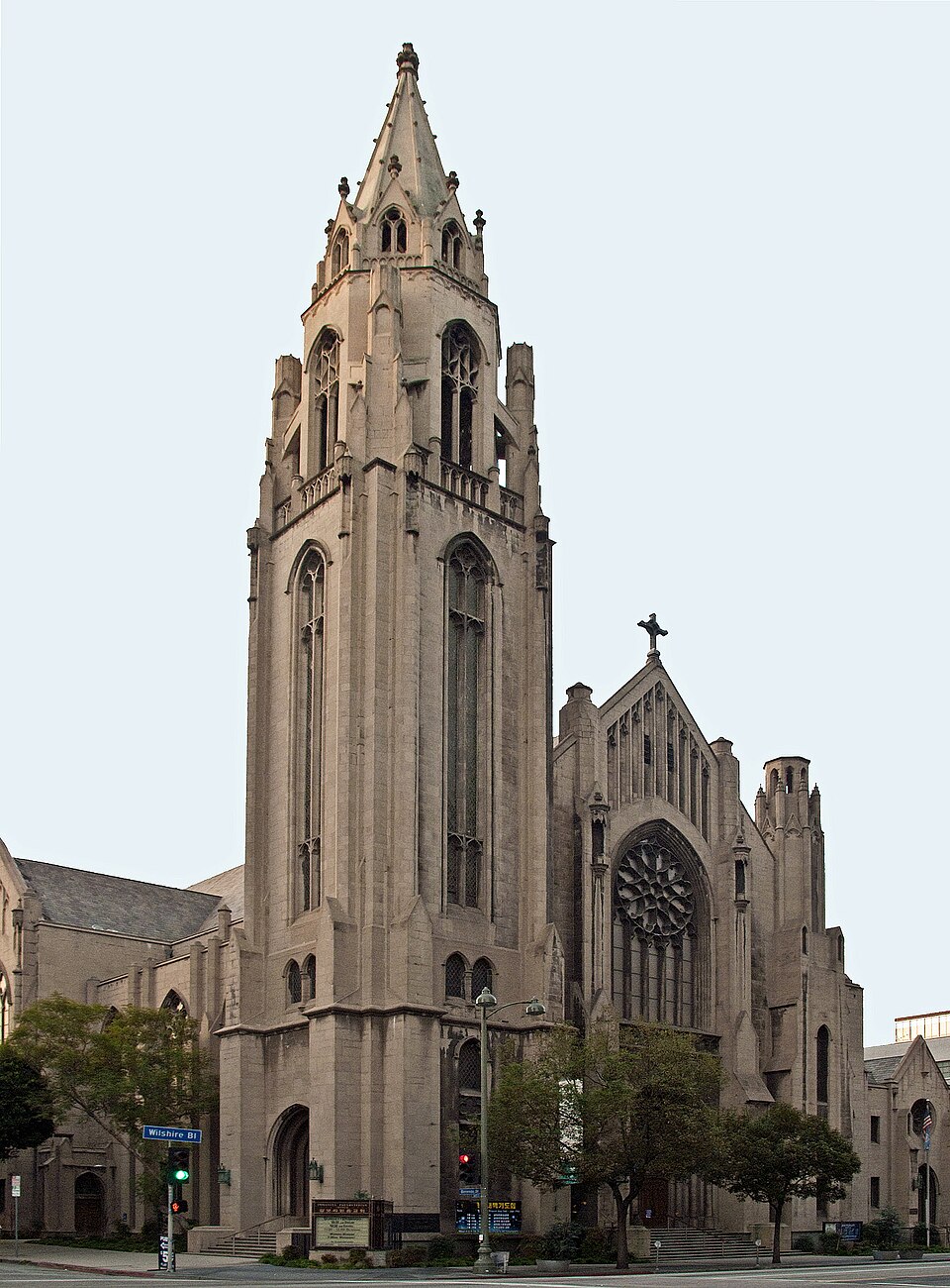 Immanuel Presbyterian Church's Gothic tower and rose window on Wilshire Boulevard, seen from the street corner.