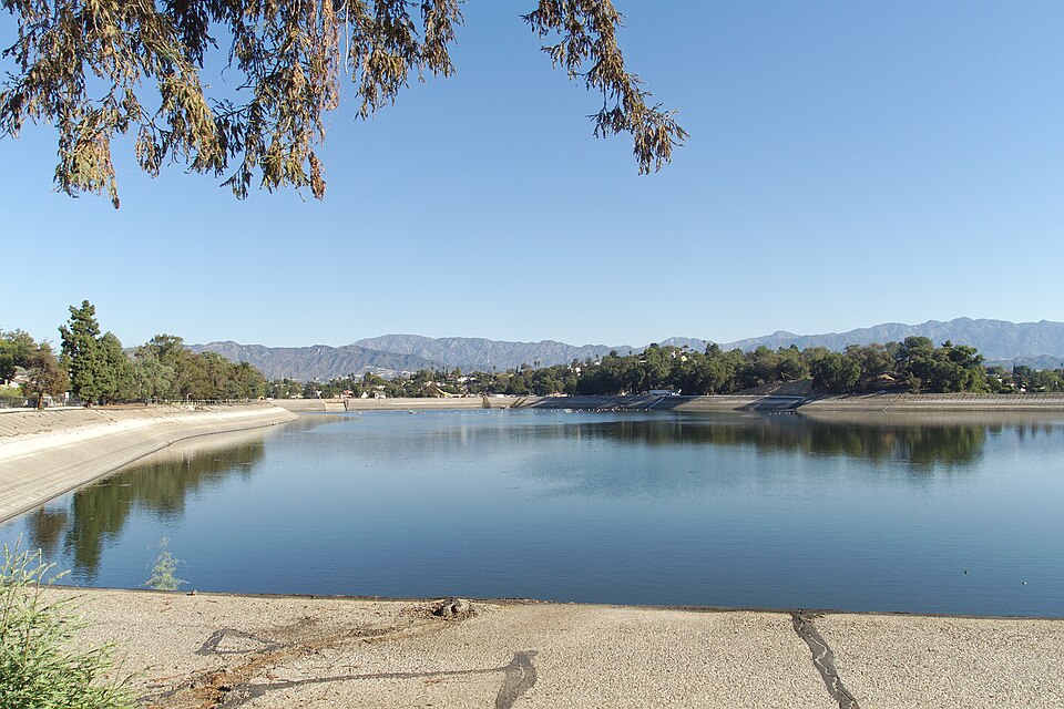 The Silver Lake Reservoir looking north from its southwestern end, hillside houses on the far bank.