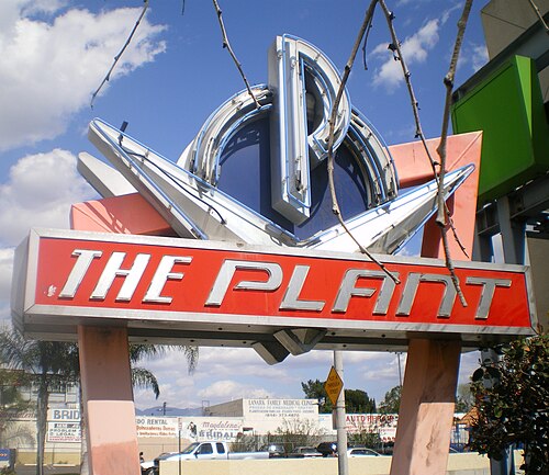 The retro sign for The Plant shopping center, a red and silver Googie style marker on the site of the old GM Van Nuys Assembly plant.