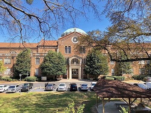 The former Girls High School building on Rosalia Street, a domed brick school building with a columned entrance, now apartments.