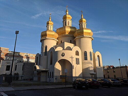 Saint Michael the Archangel Ukrainian Catholic Church off Eastern Avenue, three white towers each topped with a gold onion dome.