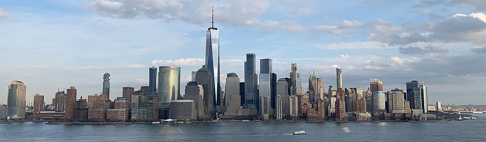A panorama of Lower Manhattan's skyline across the Hudson, One World Trade Center at center, taken from Exchange Place.