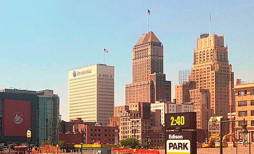 The Newark skyline across a parking lot, a stepped Art Deco crown among the office towers.