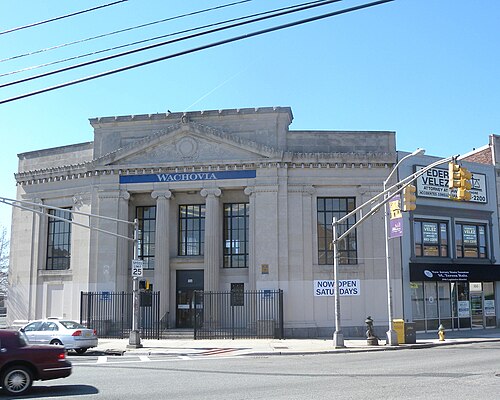 A limestone bank building on Bloomfield Avenue with paired Ionic columns and a pediment, an attorney's office next door, now a Wells Fargo branch.