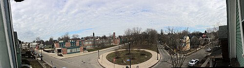 An elevated panoramic view of Days Park, its circular walkway and surrounding streets under bare winter trees.