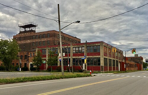 The Barcalo Manufacturing complex, a large red brick industrial building filling a full block off Louisiana Street.
