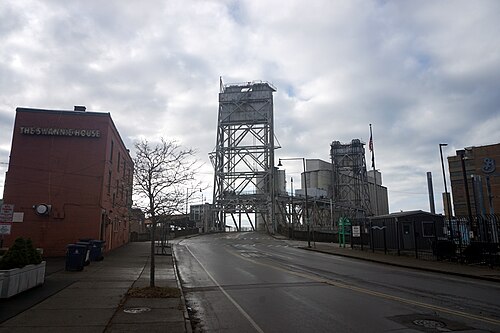 The Michigan Avenue lift bridge over the Buffalo River, with concrete grain elevators behind it.