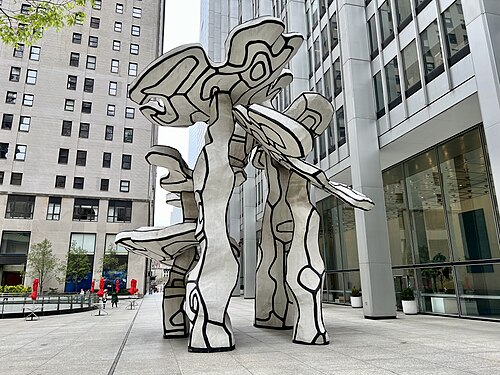 Jean Dubuffet's Group of Four Trees on the plaza at 28 Liberty Street, white with black outlines, standing on four legs over the paving.