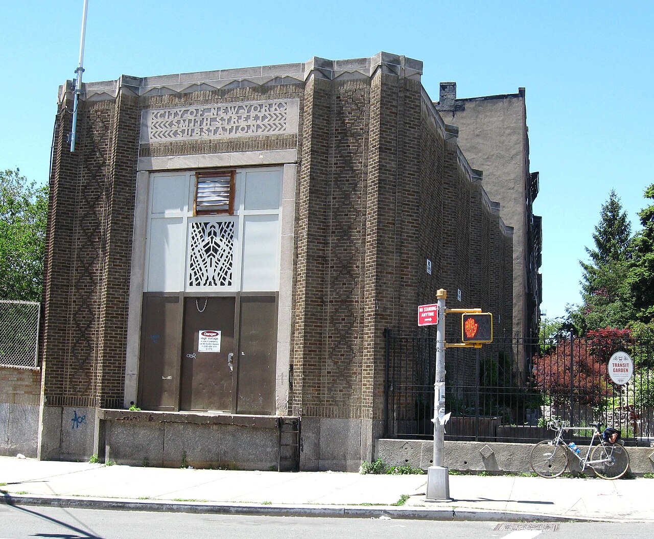 The Smith Street Substation, a brick and limestone box with City of New York cut into the stone above the doors.