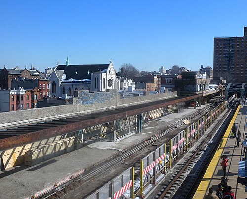 Looking east over the rooftops from the Fourth Avenue platform, St Thomas Aquinas Church in the middle distance and the platform below under reconstruction.