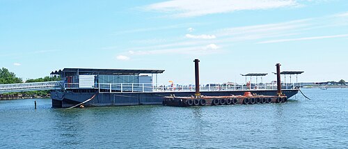 The Floating Pool Lady, a swimming pool built into a barge at Barretto Point Park, seen from the fishing pier beside it.