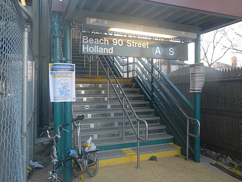 The street stair at Beach 90th Street in November 2012, closed after Hurricane Sandy, with service notices taped to the columns and a folded bike at the bottom.