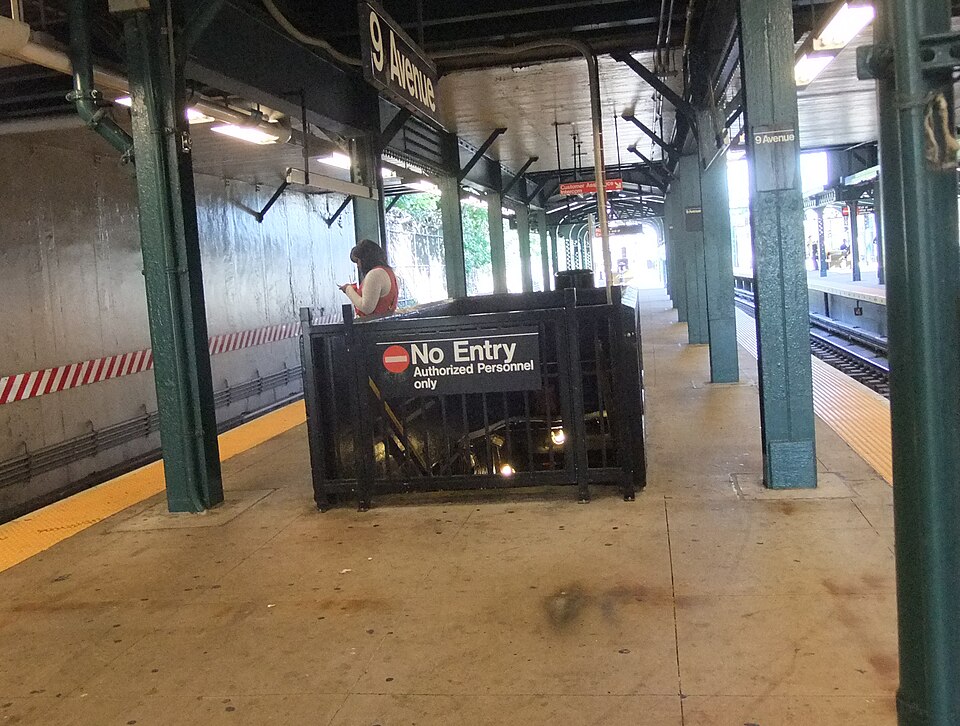 The upper platform at the Ninth Avenue station, with the gated stair down to the closed lower level marked No Entry.