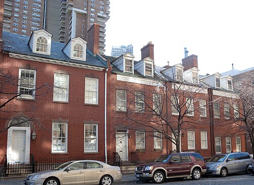 The federal rowhouses at 29 to 41 Harrison Street over Belgian block paving.