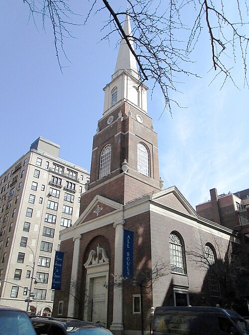 The Unitarian Church of All Souls at Lexington Avenue and East 80th Street, red brick with a white steeple, an apartment building right next to it.