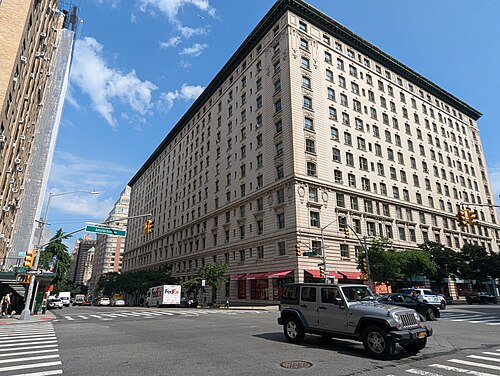 The Belnord from the Amsterdam Avenue corner, a limestone front the length of the block with a heavy cornice on top and stores in the base.