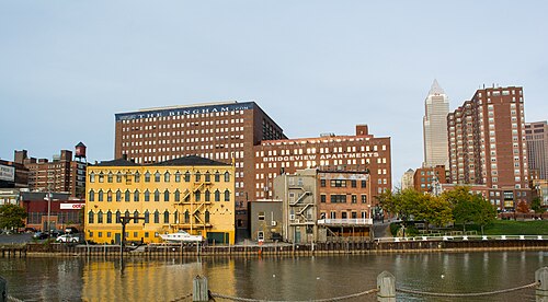 The Bingham and the Bridgeview Apartments, converted brick warehouse towers on the riverfront, with Key Tower behind them.