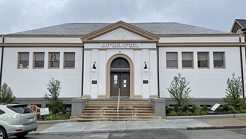 The Mount Washington branch library on Grandview Avenue, a single storey white painted brick building with a pedimented entrance and stone steps.