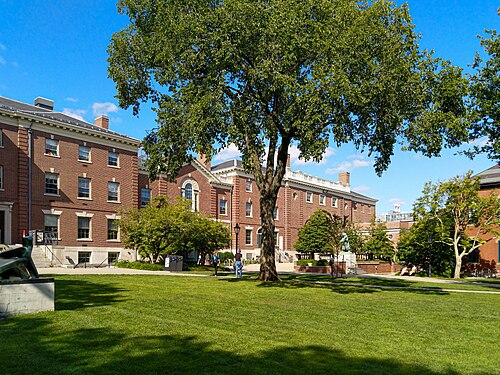 The Main Green at Brown University, red brick university halls around an open lawn with mature trees.